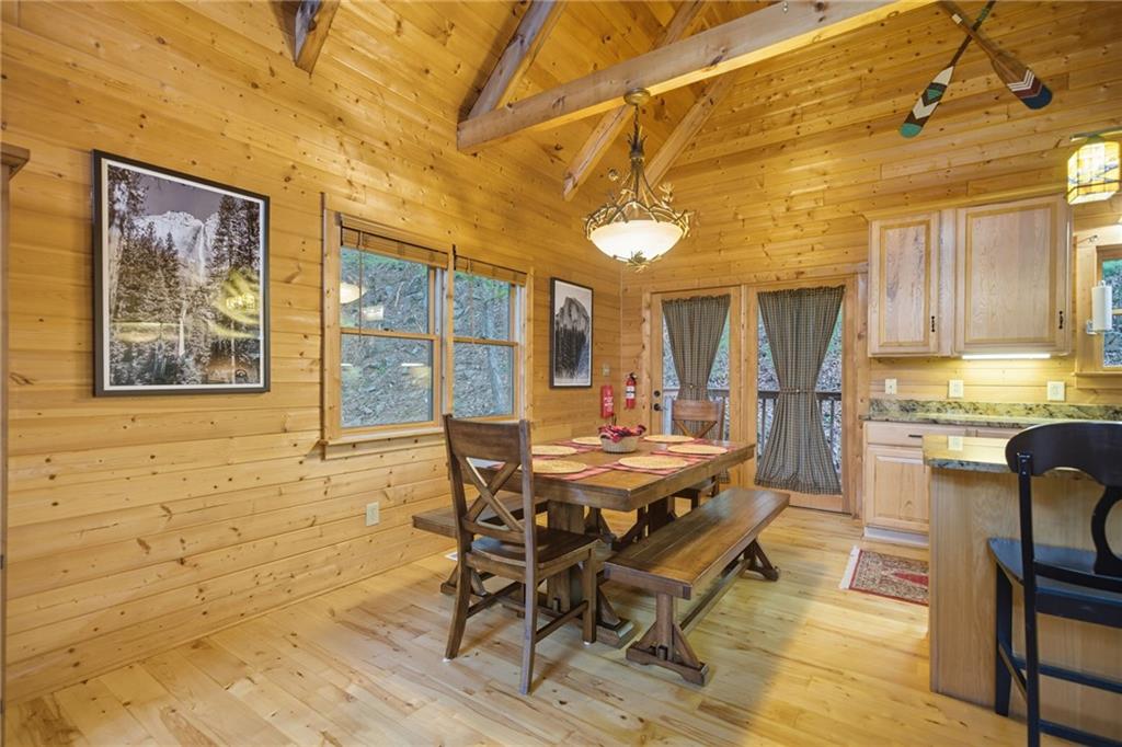 469 Moss Patch Trail Jasper, GA 30143 - Photo 12 of 49 a view of a dining room with furniture and a chandelier