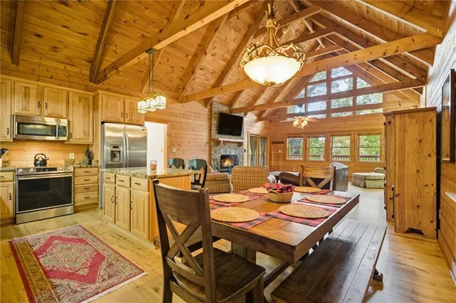 a kitchen with refrigerator and stove
