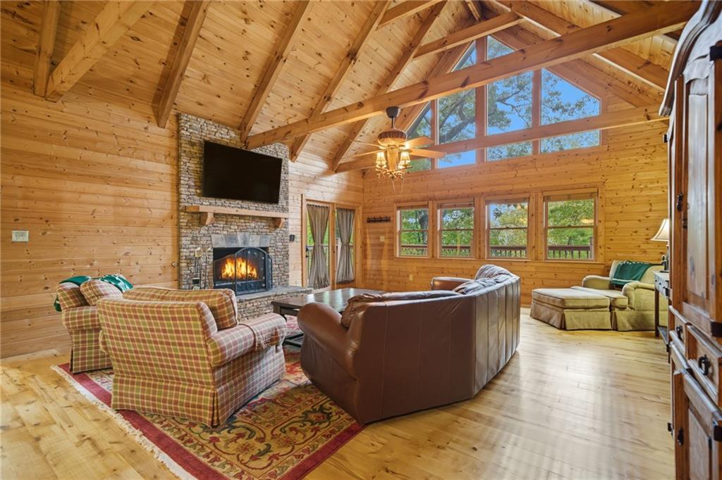469 Moss Patch Trail Jasper, GA 30143 - Photo 2 of 49 a living room with furniture a fireplace and a flat screen tv