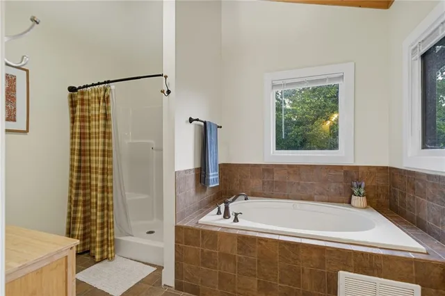 a bedroom with two beds and window