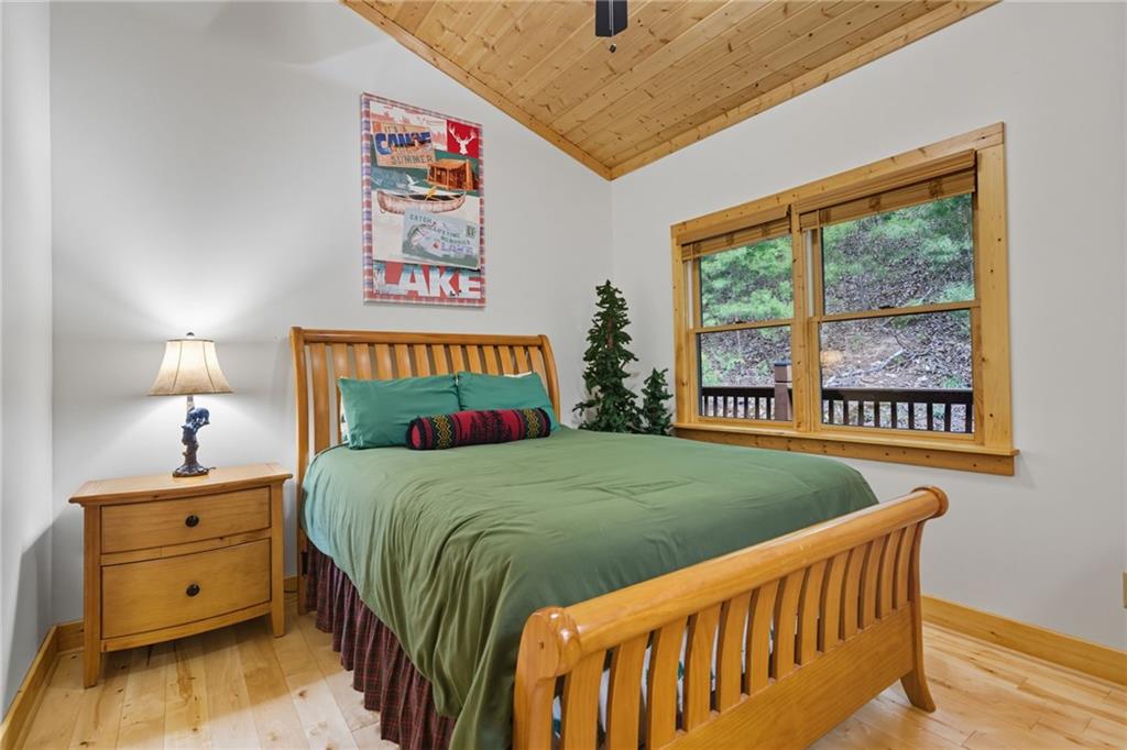 469 Moss Patch Trail Jasper, GA 30143 - Photo 26 of 49 a bed room with a bed and a window