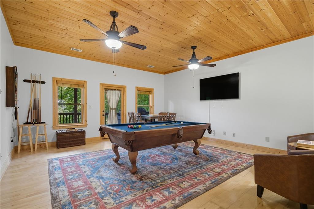 469 Moss Patch Trail Jasper, GA 30143 - Photo 27 of 49 a living room with furniture and a flat screen tv