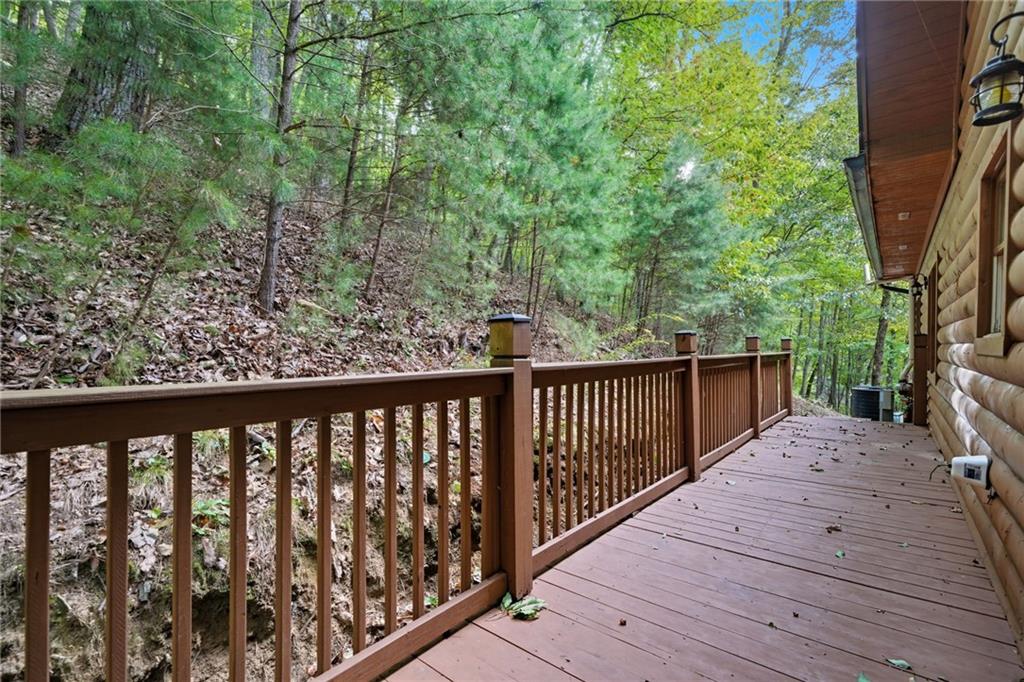 469 Moss Patch Trail Jasper, GA 30143 - Photo 35 of 49 a balcony with wooden floor and fence