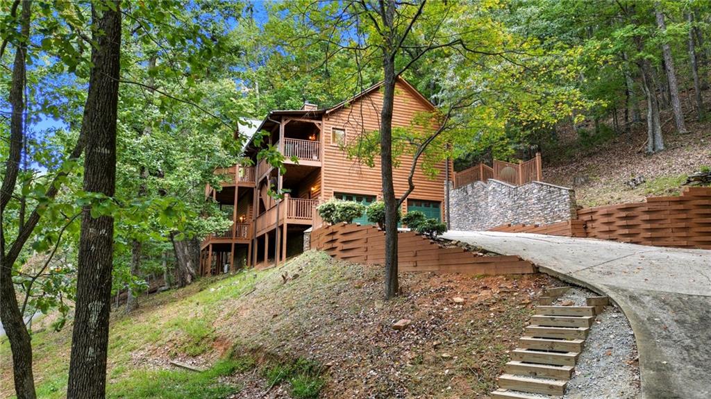 469 Moss Patch Trail Jasper, GA 30143 - Photo 38 of 49 a view of a house with backyard and sitting area