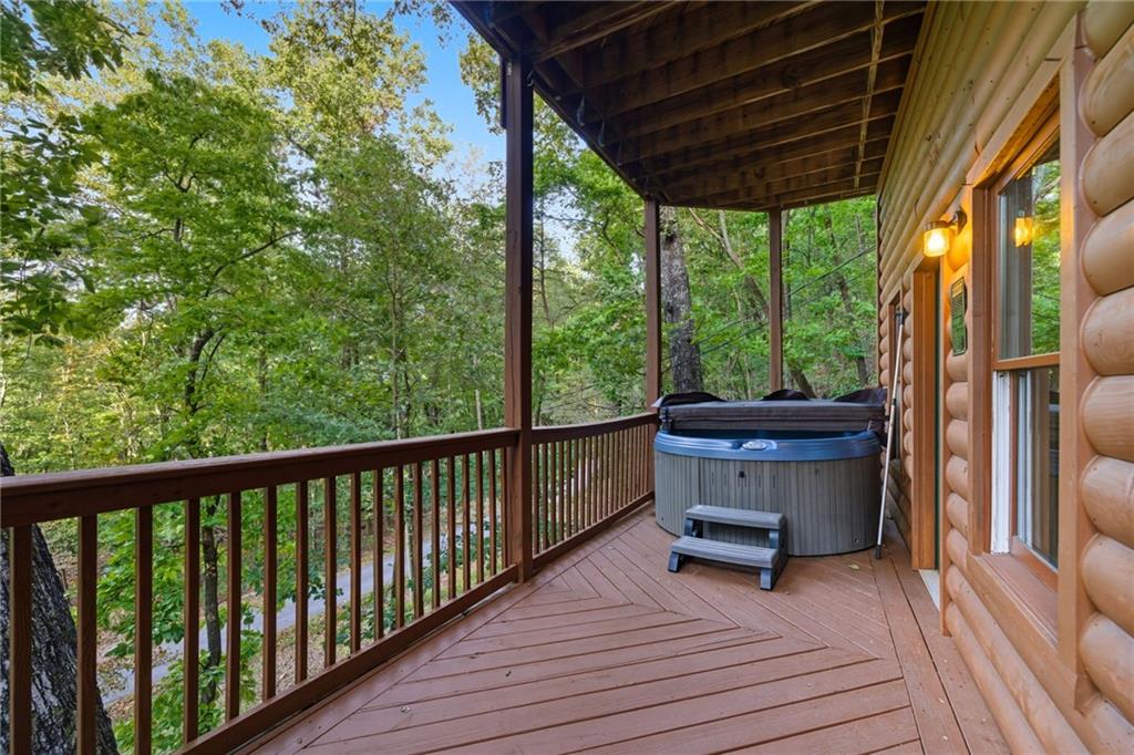 469 Moss Patch Trail Jasper, GA 30143 - Photo 4 of 49 a view of balcony with wooden floor and seating space