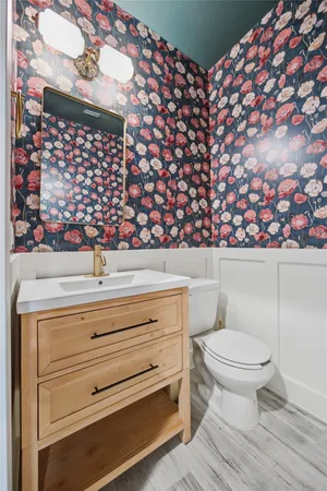 a bedroom with a bed and a chair