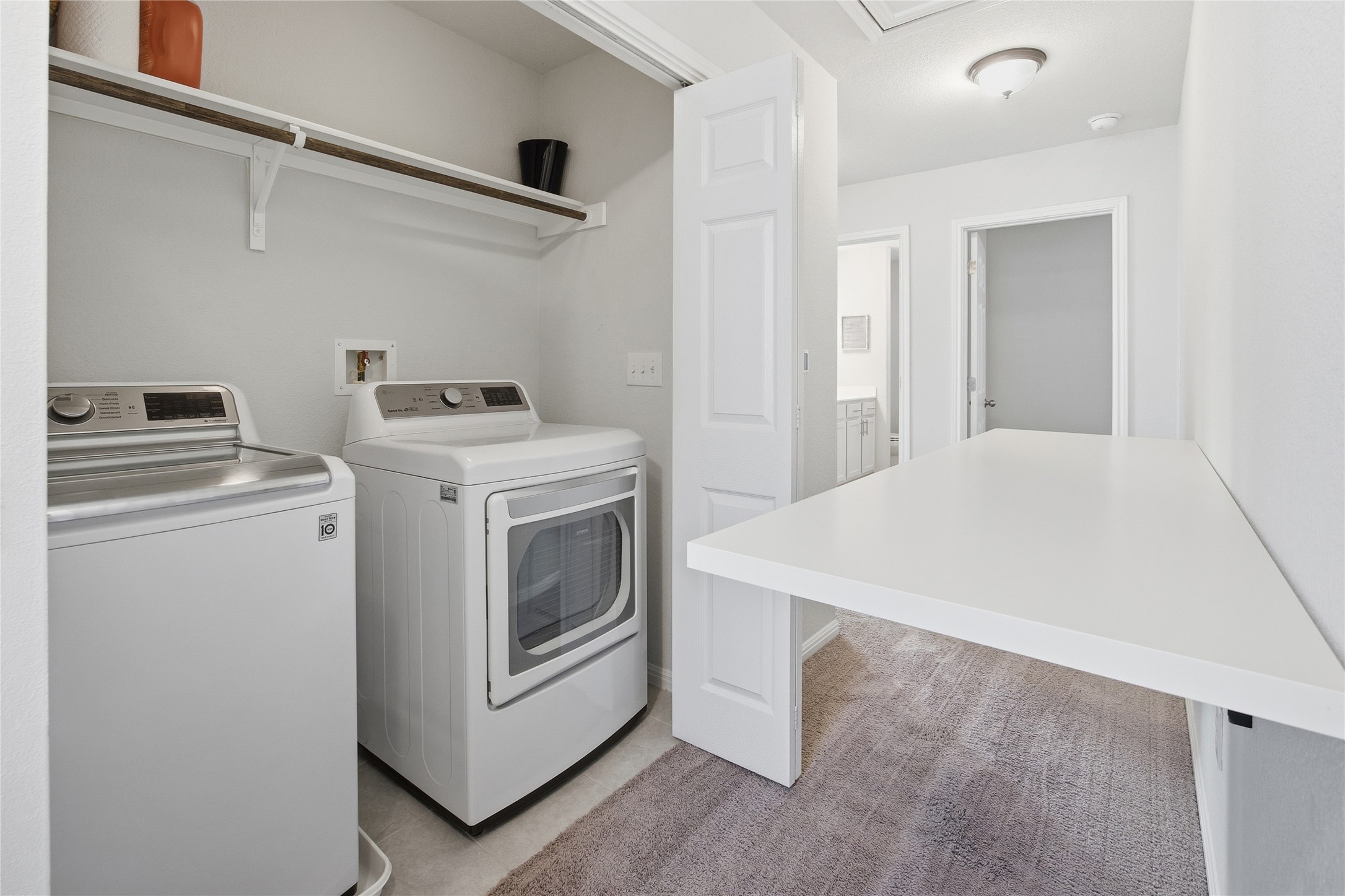 6402 Moncrieff Drive Austin, TX 78747 - Photo 30 of 37 Mounted folding table for folding clothes