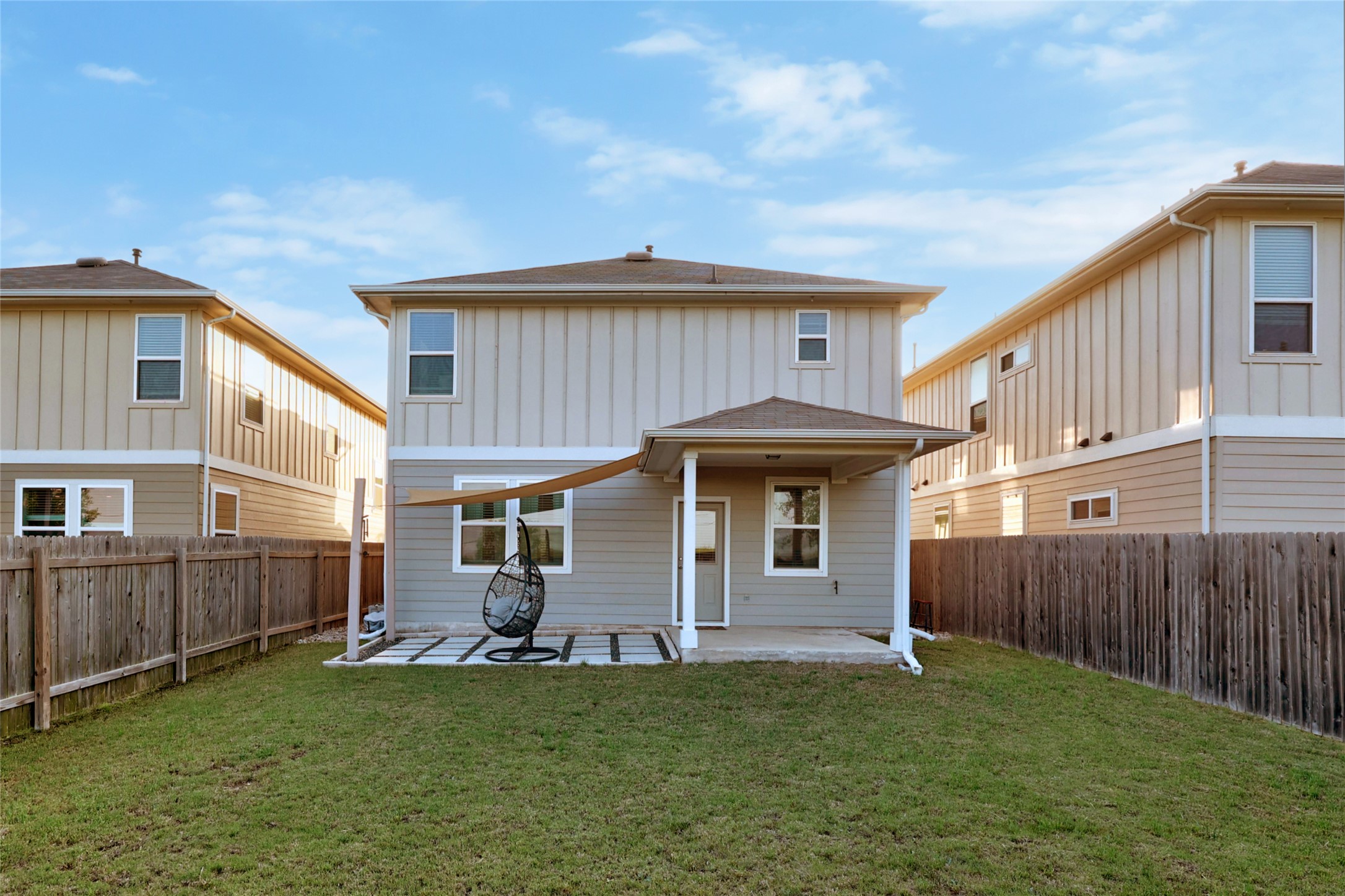 6402 Moncrieff Drive Austin, TX 78747 - Photo 31 of 37 Rear view of house with a patio area and a fenced backyard
