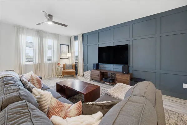 a kitchen with stainless steel appliances a refrigerator sink and white cabinets