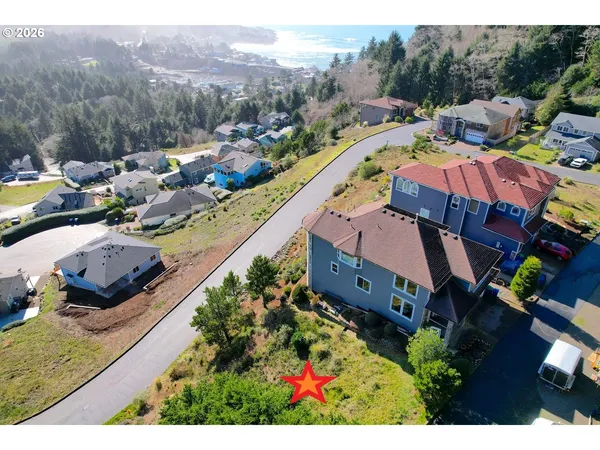 an aerial view of a house with a garden
