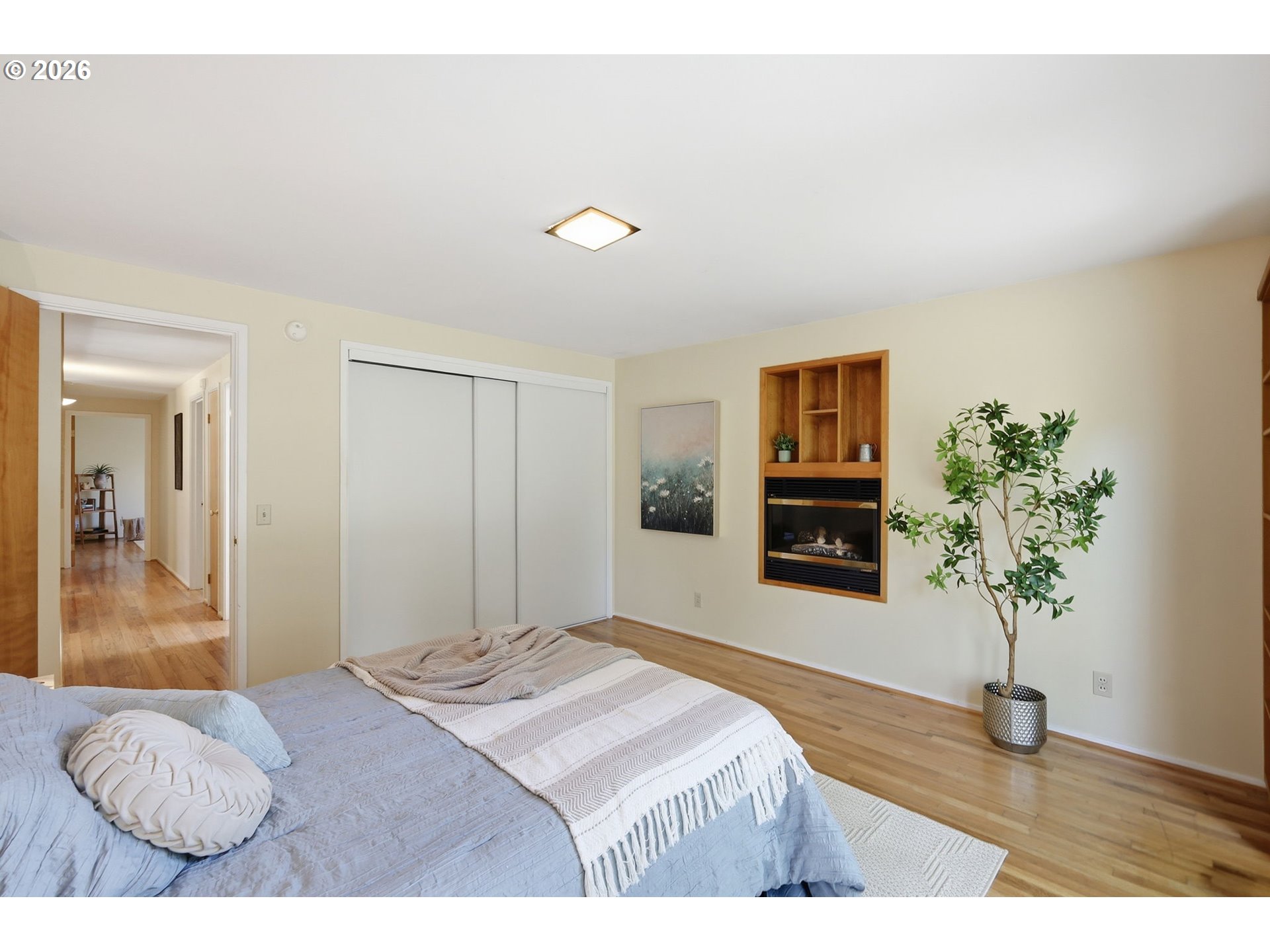 3025 Harris Street Eugene, OR 97405 - Photo 31 of 44 a bedroom with a bed and a potted plant