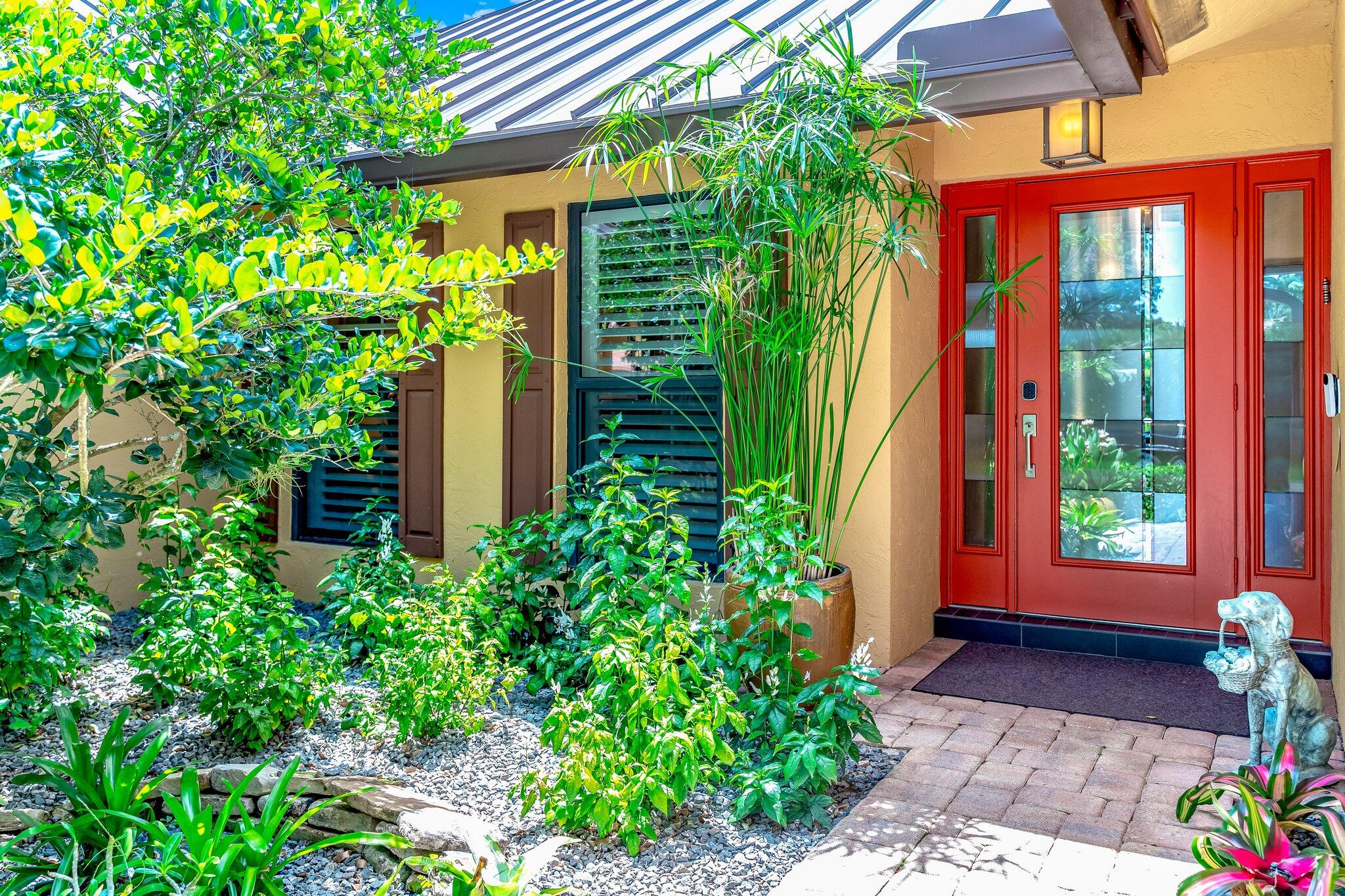 3484 Pine Haven Circle Boca Raton, FL 33431 - Photo 1 of 80 a front view of a house with a yard