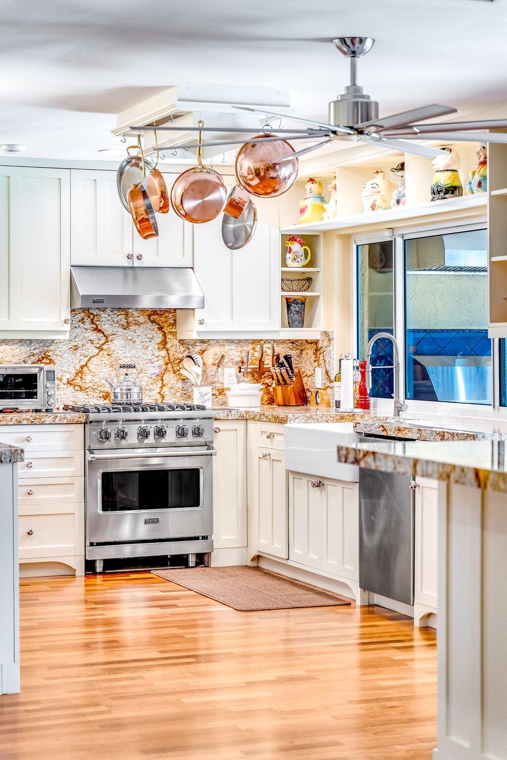 3484 Pine Haven Circle Boca Raton, FL 33431 - Photo 13 of 80 a view of a kitchen with stainless steel appliances wooden floor and dining table