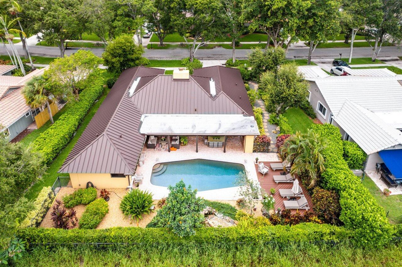 3484 Pine Haven Circle Boca Raton, FL 33431 - Photo 3 of 80 a view of a swimming pool with a patio