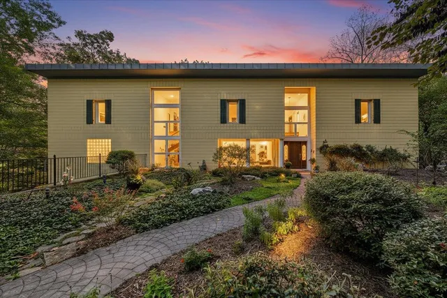 a front view of a house with garden