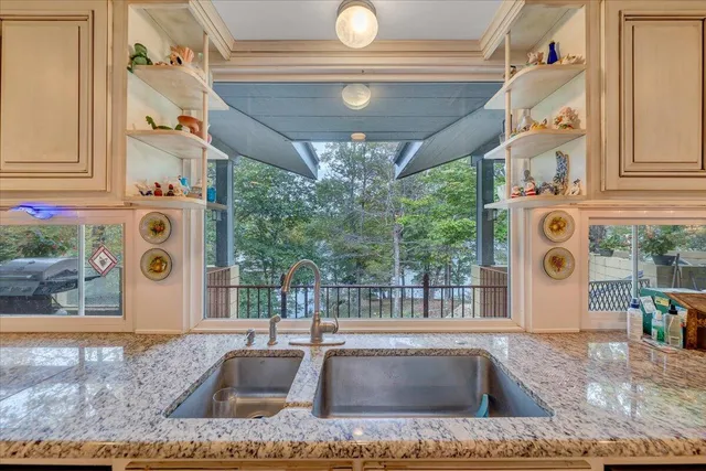 a bathroom with a shower and a glass door