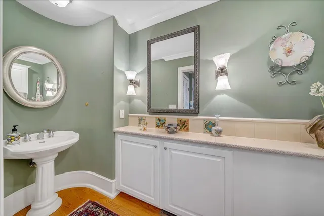 a bathroom with a sink a mirror and shower