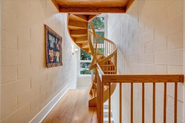a view of a house with yard and sitting area