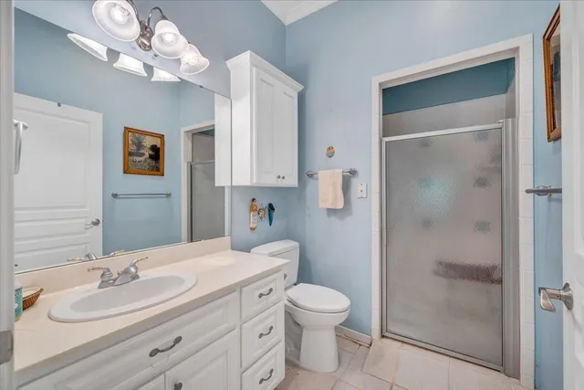 an aerial view of a house with a yard and lake view