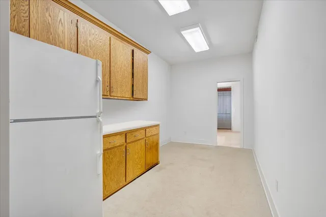 an aerial view of a houses with a lake view