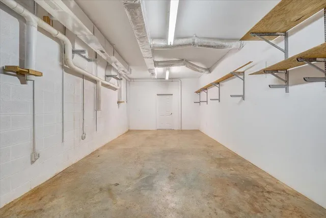 an aerial view of a house with a yard and lake view