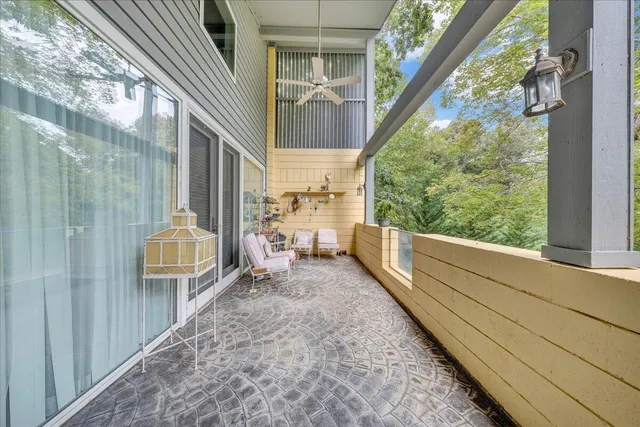 a aerial view of a house with swimming pool and a yard