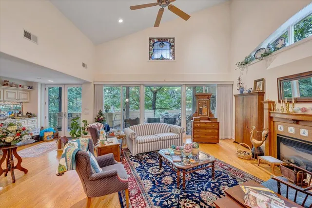 a kitchen with kitchen island granite countertop a sink a counter top space and cabinets