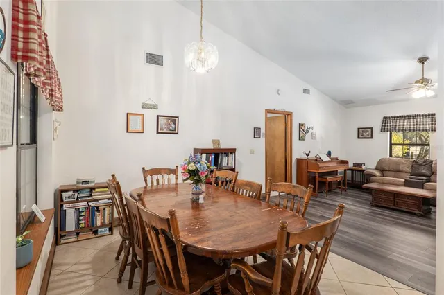 a backyard of a house with lots of green space and a fountain
