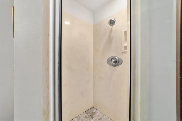 a view of dirt yard with trees