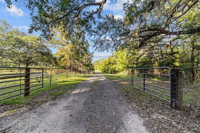 a view of a workspace with furniture and wooden floor