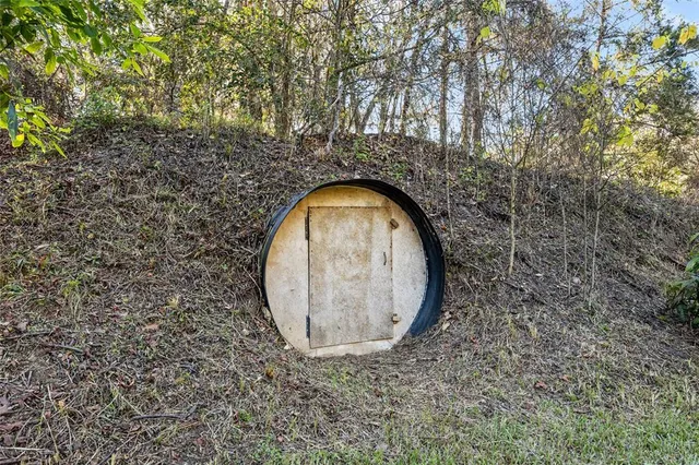 a bedroom with a bed and a chair in it