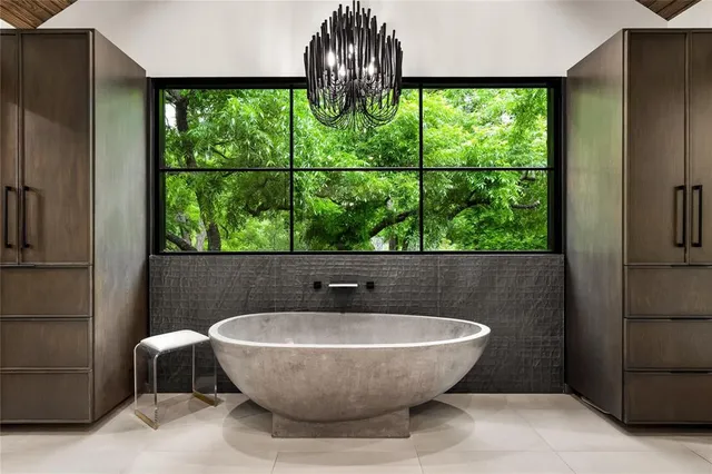 a bathroom with a tub and sink