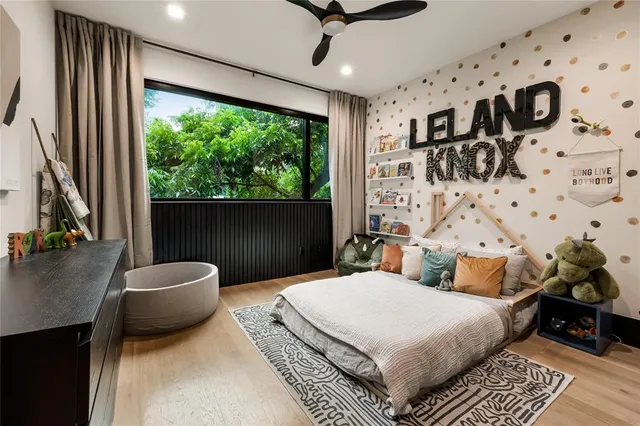 a bathroom with a granite countertop sink a toilet a mirror and shower