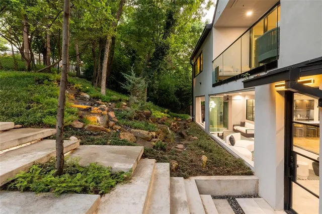 a view of a yard with potted plants