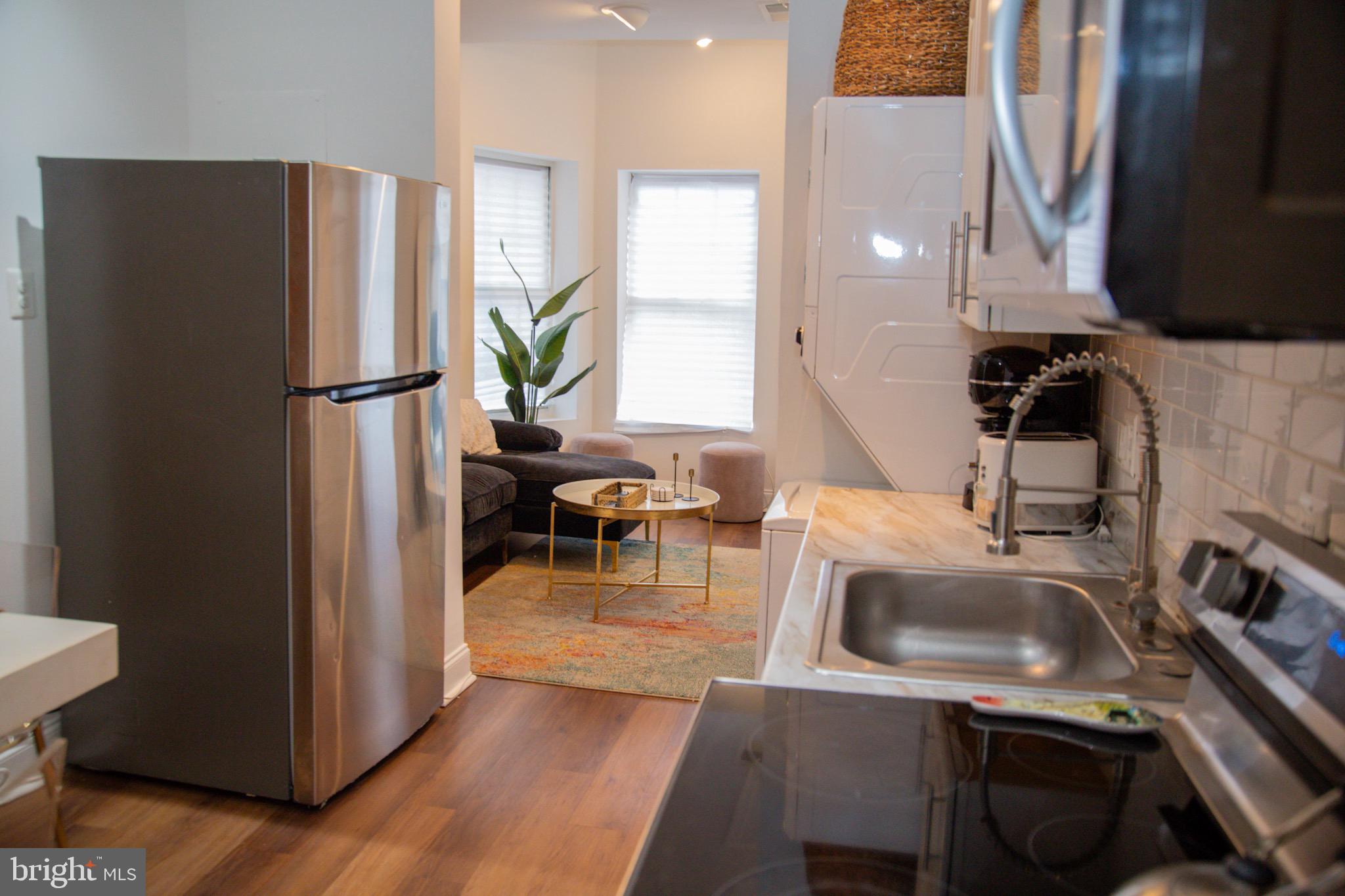 1345 1st Street Northwest, Unit 2 Washington, DC 20001 - Photo 4 of 11 Modern kitchen with cozy living space.