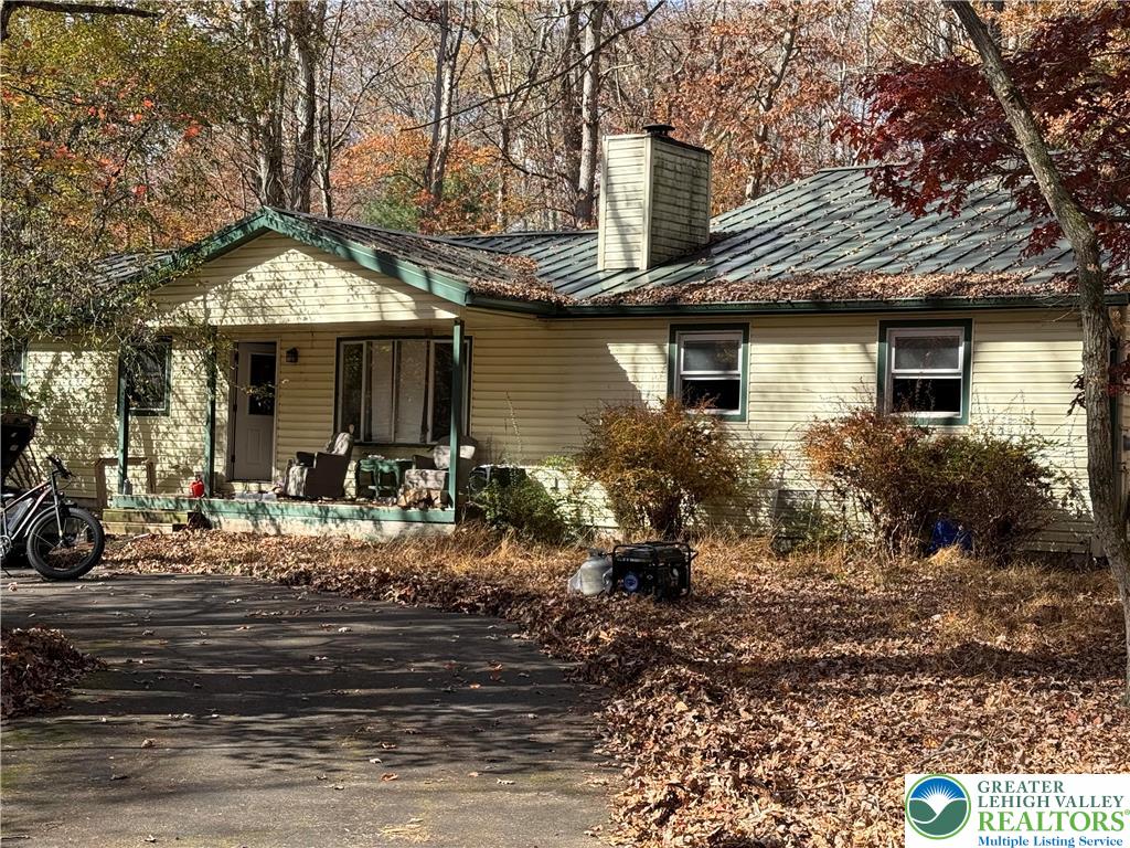 3143 Bear Swamp Road East Stroudsburg, PA 18302 - Photo 2 of 6 a front view of a house with garden