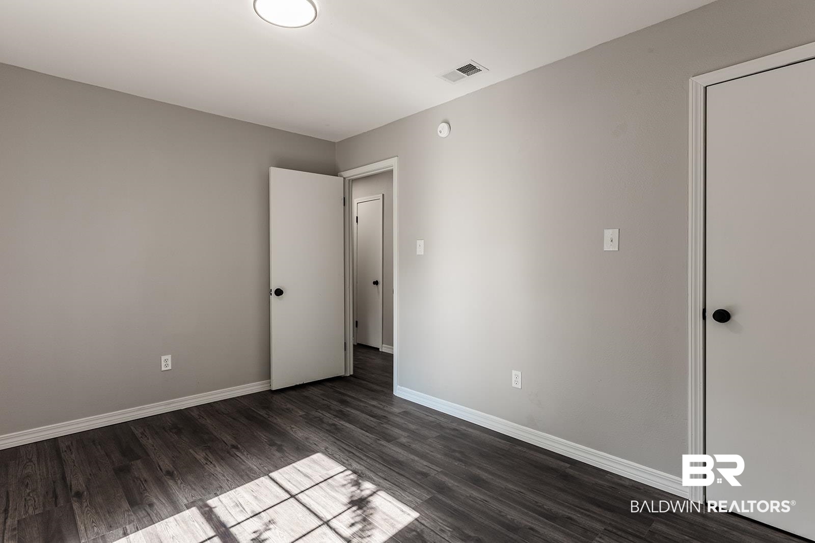 4626 Gold Drive Mobile, AL 36619 - Photo 34 of 48 Unfurnished bedroom with wood-type flooring