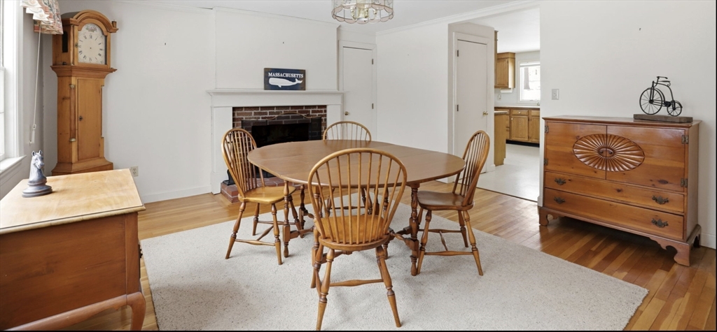 49 Jackson Road Scituate, MA 02066 - Photo 12 of 25 a dining room with furniture and wooden floor