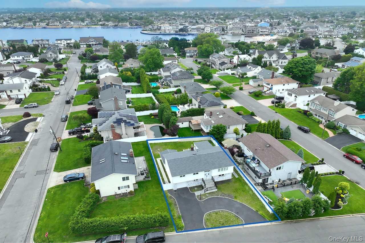 107 Beverly Road Massapequa, NY 11758 - Photo 39 of 41 an aerial view of residential houses with outdoor space