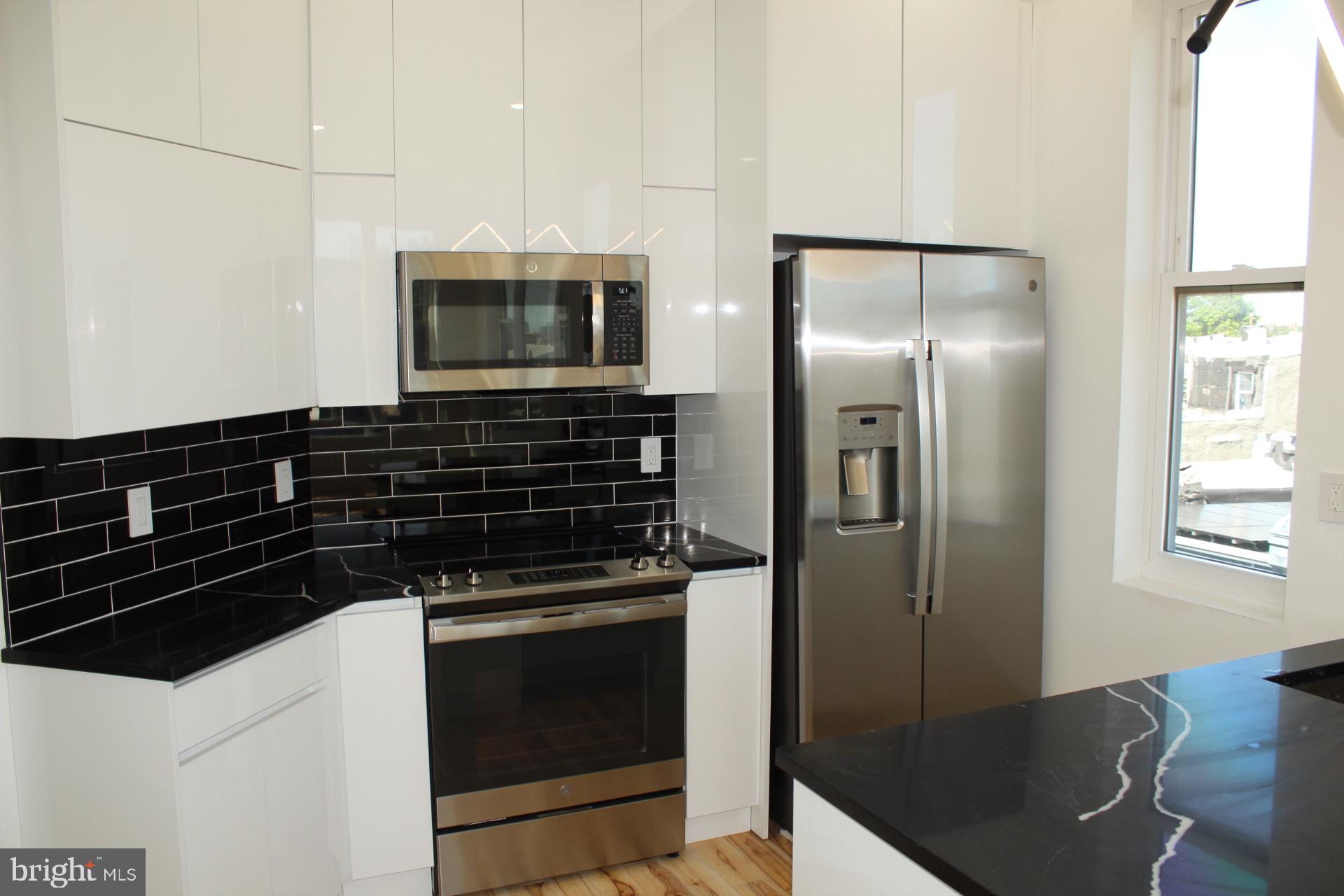 3017 Ridge Avenue, Unit B Philadelphia, PA 19121 - Photo 11 of 29 Sleek modern kitchen with stylish finishes.