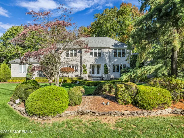 a aerial view of a house with swimming pool garden and patio