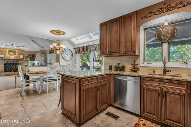 a living room with a fireplace furniture and a large window