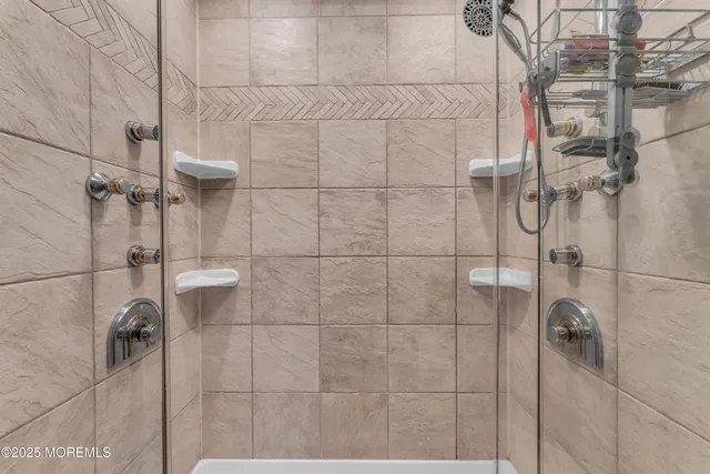 a white bath tub sitting next to a white sink