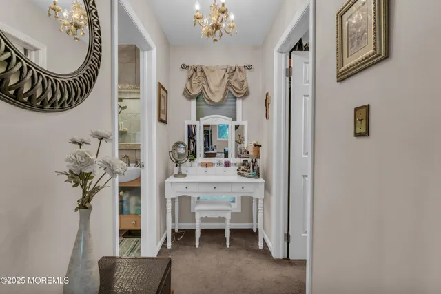 a living room with furniture a air conditioner and a table