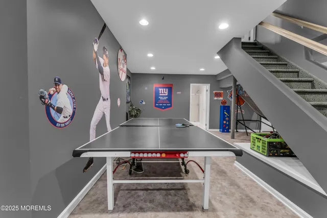 a view of a patio with table and chairs under an umbrella