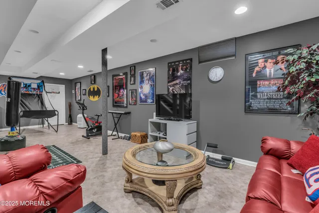 a view of a house with a yard and large tree