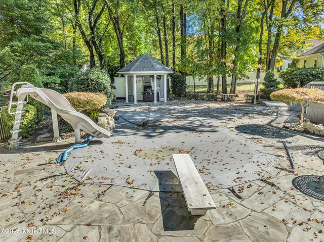 a view of a lounge chair in the backyard