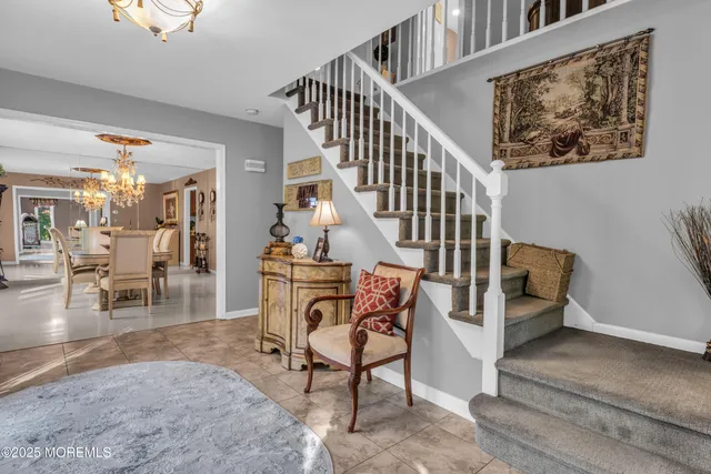 a kitchen with stainless steel appliances granite countertop a stove a sink dishwasher and cabinets with wooden floor