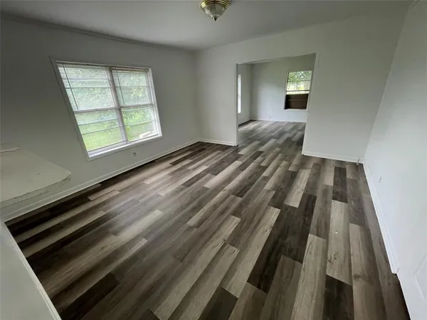 a view of room with wooden floor