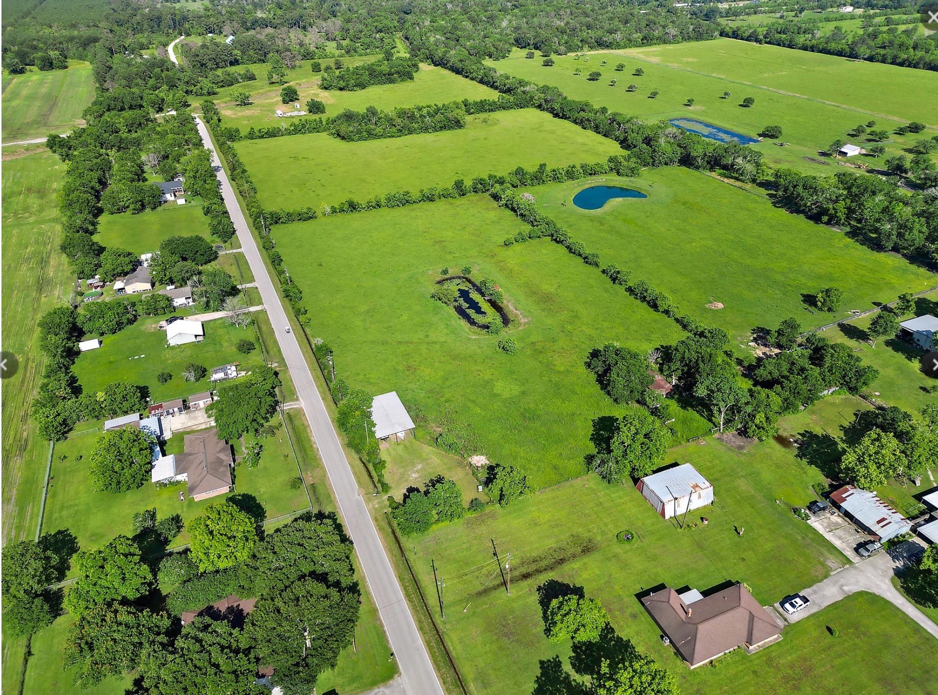 an aerial view of a golf course with parking space